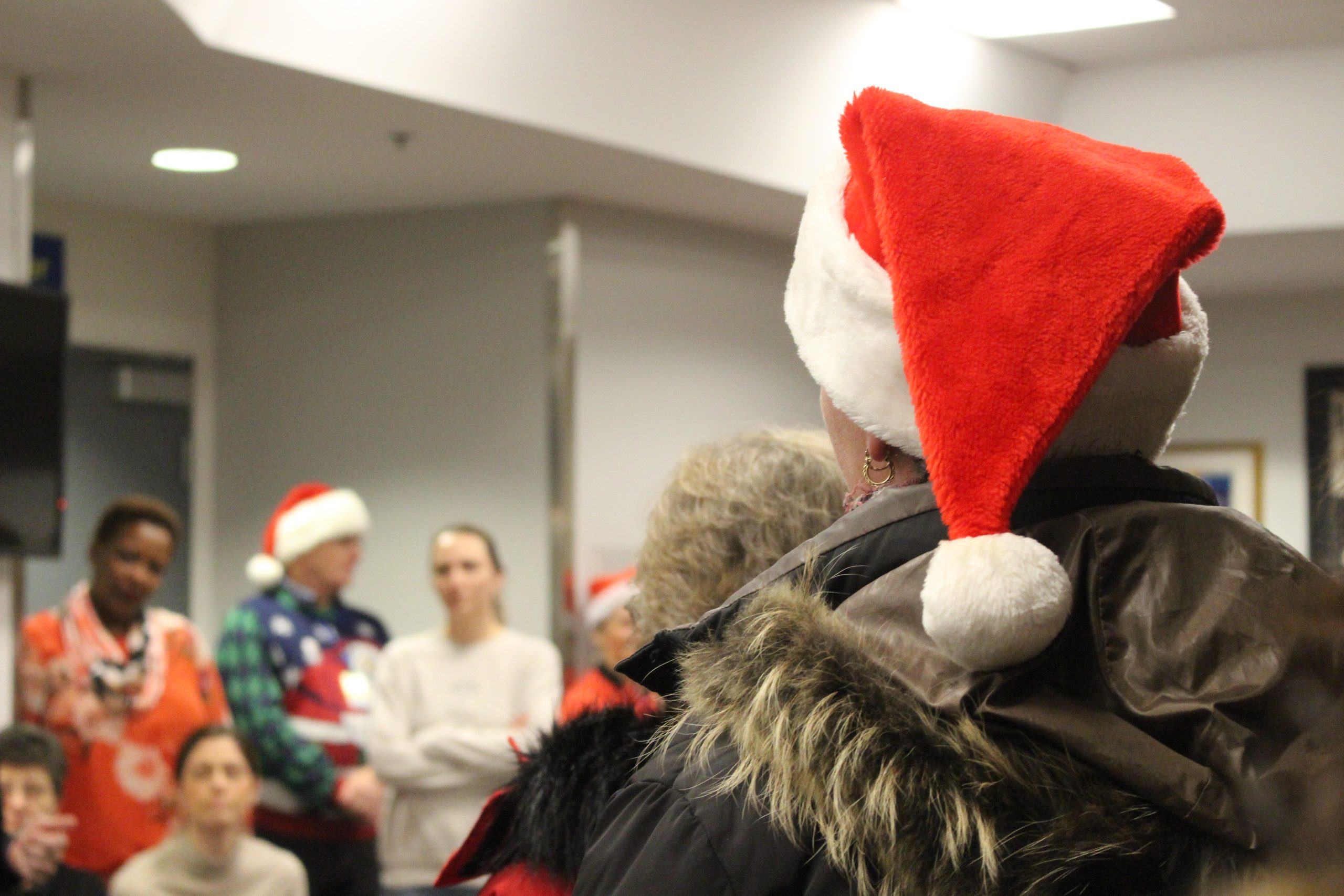 Santa presenting gifts donated to children in Ottawa